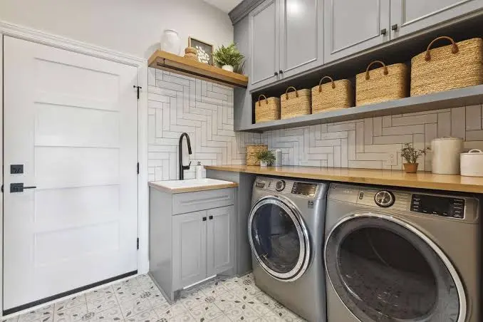 Clean organized laundry room with washer and dryer